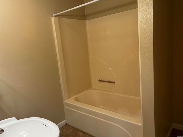 bathroom featuring sink and  shower combination