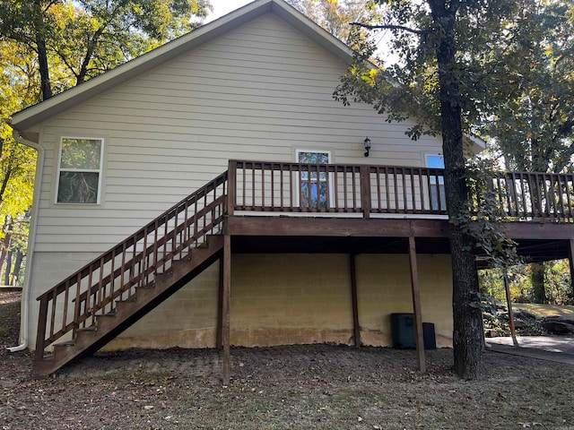 back of property with a wooden deck