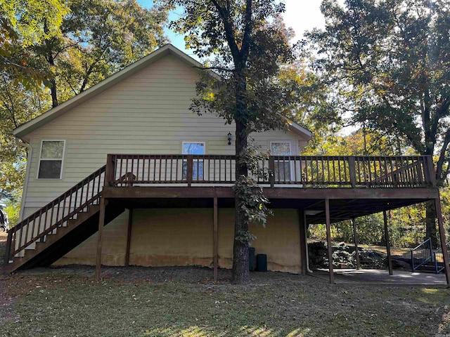 back of property with a wooden deck