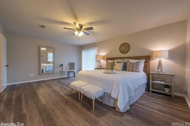 bedroom with dark wood-type flooring and ceiling fan