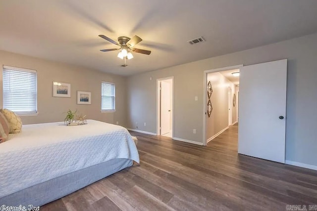 bedroom featuring dark hardwood / wood-style flooring and ceiling fan