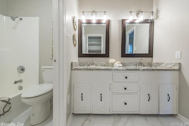 full bathroom featuring toilet, shower / bathing tub combination, and vanity