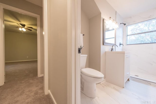 bathroom featuring toilet, a shower, and ceiling fan