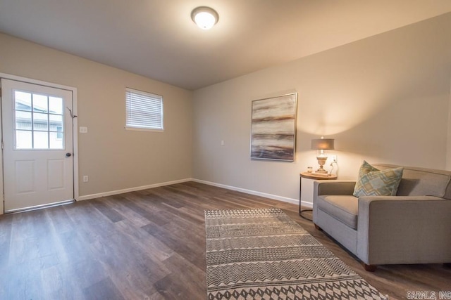 unfurnished room with dark wood-type flooring