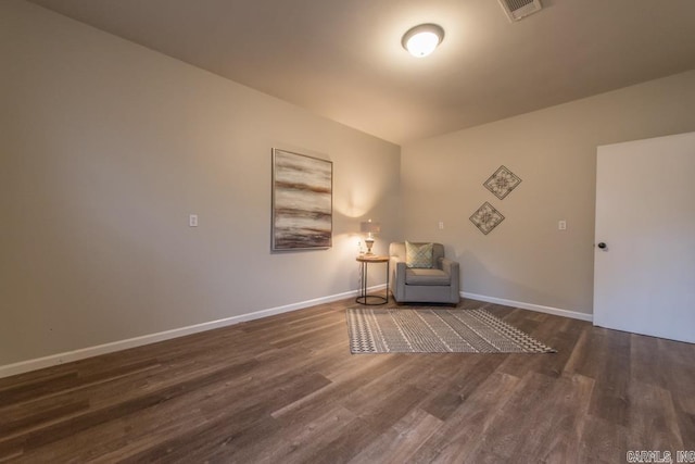 unfurnished room featuring dark wood-type flooring