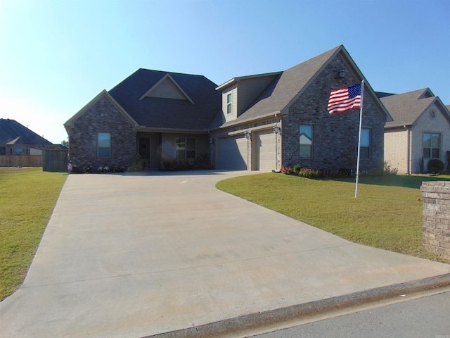 view of front of home with a front lawn and a garage