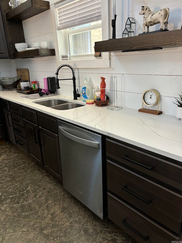 kitchen featuring decorative backsplash, dishwasher, sink, and light stone counters