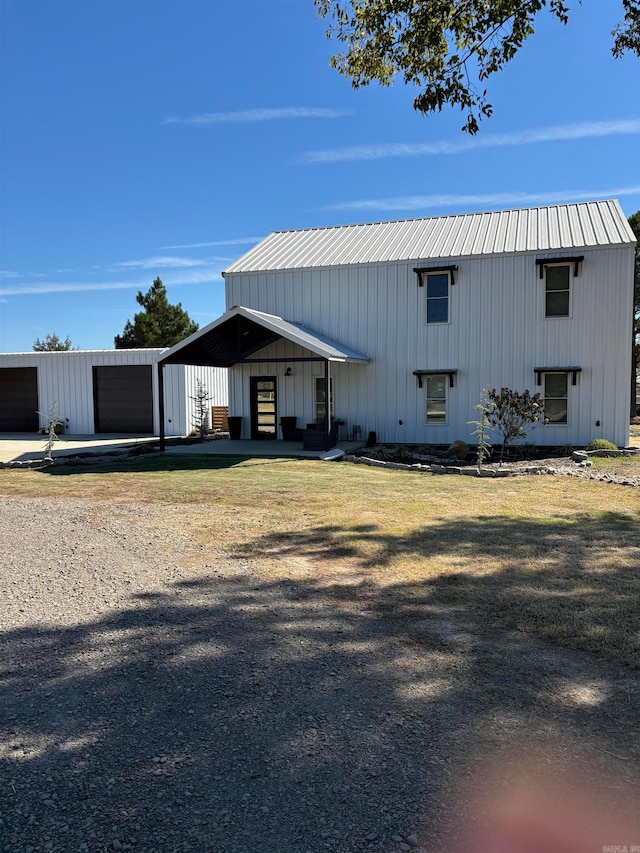 exterior space featuring a front yard and a garage