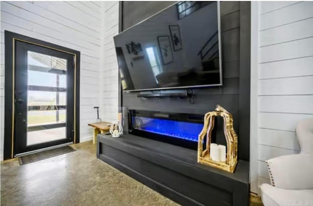 living room featuring wood walls