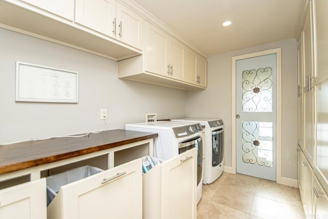washroom with washer and clothes dryer, light tile patterned floors, cabinet space, baseboards, and recessed lighting