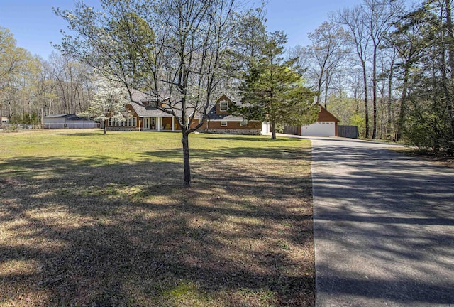 exterior space featuring a front lawn and a garage