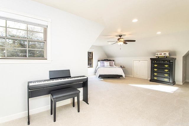 bedroom with light carpet, lofted ceiling, and ceiling fan