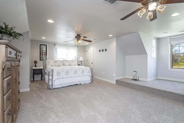 bedroom featuring recessed lighting, baseboards, visible vents, and light colored carpet