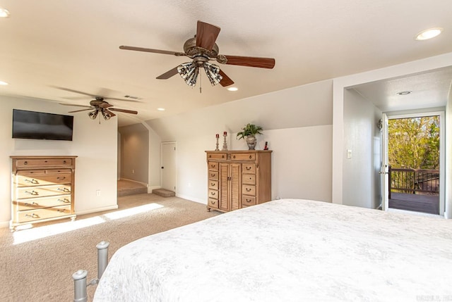 carpeted bedroom featuring access to exterior, vaulted ceiling, and ceiling fan