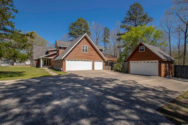 view of front of property featuring a front yard and a garage