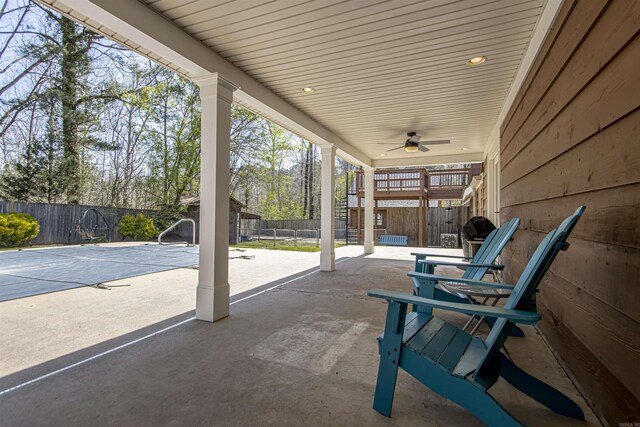 rear view of house with french doors, a playground, fence, a lawn, and a patio