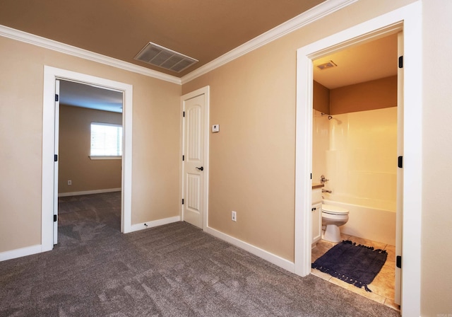 interior space featuring dark carpet and ornamental molding