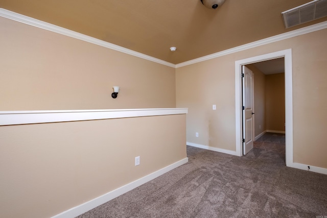 unfurnished room with carpet and crown molding