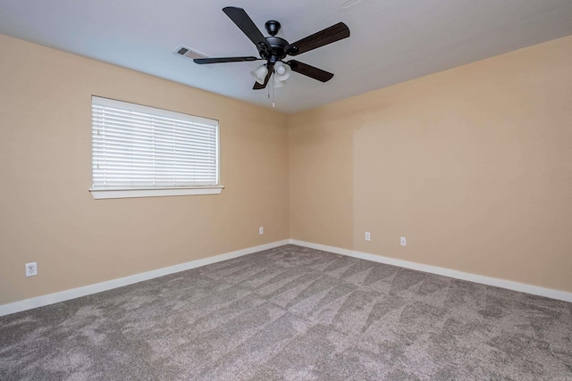 empty room featuring carpet flooring and ceiling fan