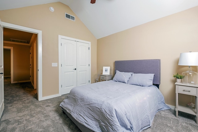 carpeted bedroom featuring lofted ceiling, a closet, and ceiling fan