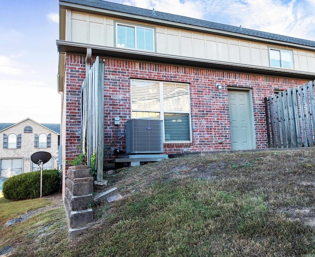 back of house with a lawn