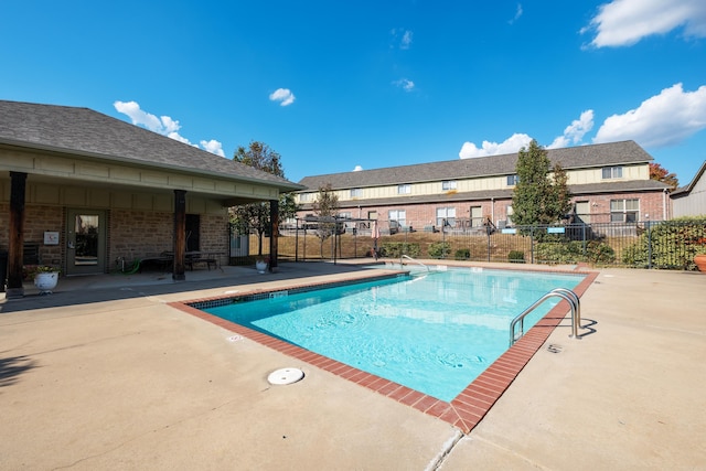 view of swimming pool featuring a patio area