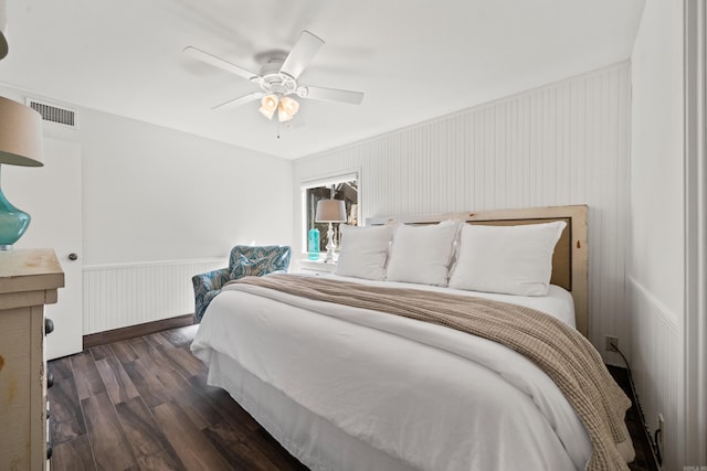 bedroom featuring ceiling fan and dark hardwood / wood-style flooring