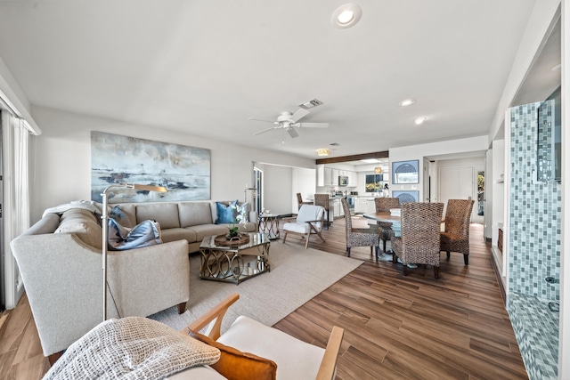 living room with ceiling fan and wood-type flooring