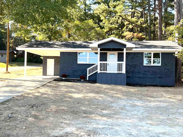 ranch-style home with a carport