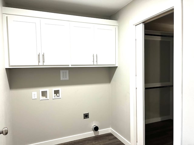 laundry area with hookup for an electric dryer, hookup for a washing machine, cabinets, and dark hardwood / wood-style flooring