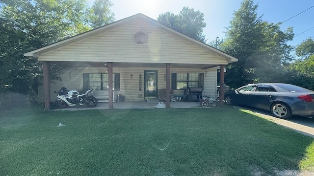 bungalow-style house featuring a front yard