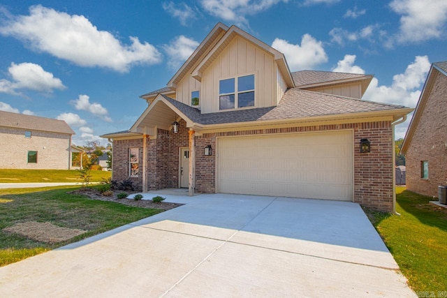 view of front of house featuring a front lawn and a garage