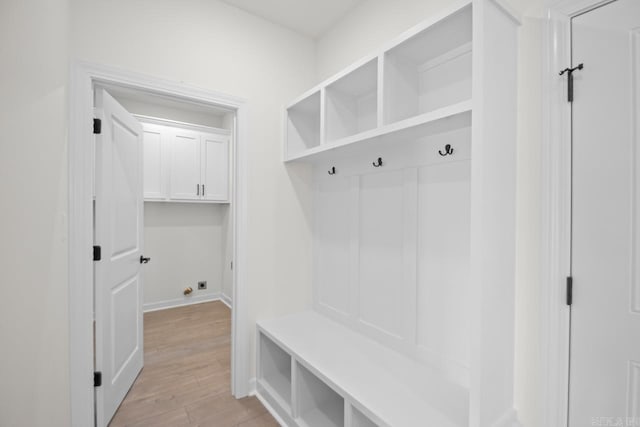 mudroom with light hardwood / wood-style flooring