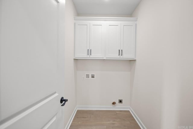 laundry room with hookup for an electric dryer, light hardwood / wood-style flooring, and hookup for a washing machine