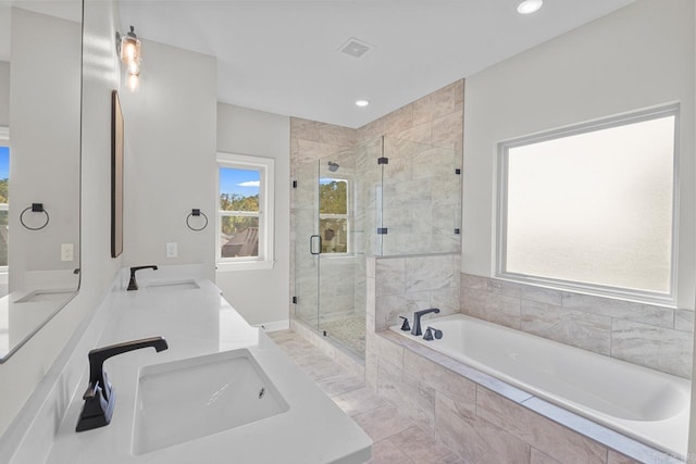 bathroom featuring vanity, separate shower and tub, and tile patterned floors