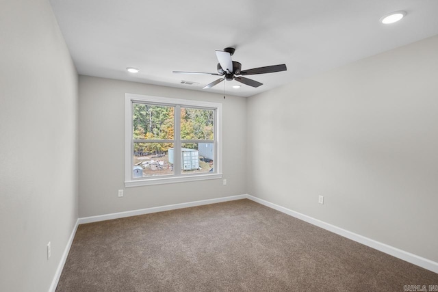 unfurnished room with carpet flooring and ceiling fan