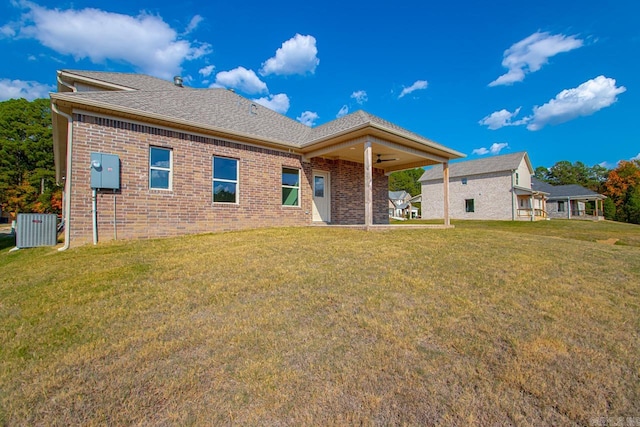 back of house with a yard