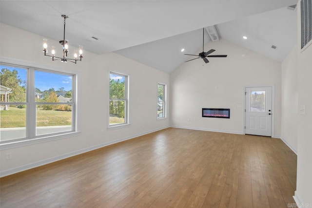 unfurnished living room with beamed ceiling, high vaulted ceiling, ceiling fan with notable chandelier, and light wood-type flooring