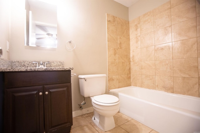 full bathroom featuring tiled shower / bath, vanity, toilet, and tile patterned flooring