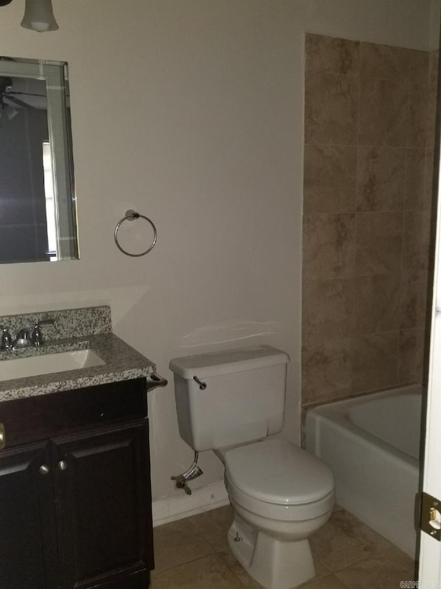 bathroom with vanity, toilet, tile patterned flooring, and ceiling fan