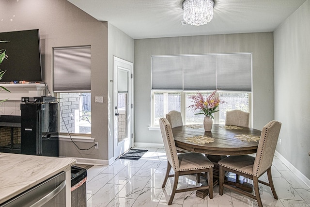 dining space featuring an inviting chandelier