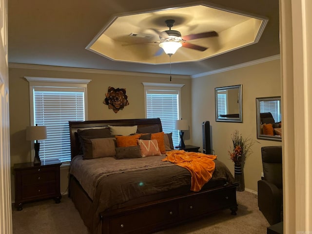 carpeted bedroom featuring crown molding and ceiling fan