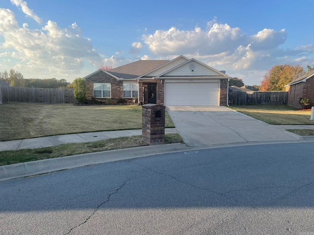 single story home with a front yard and a garage