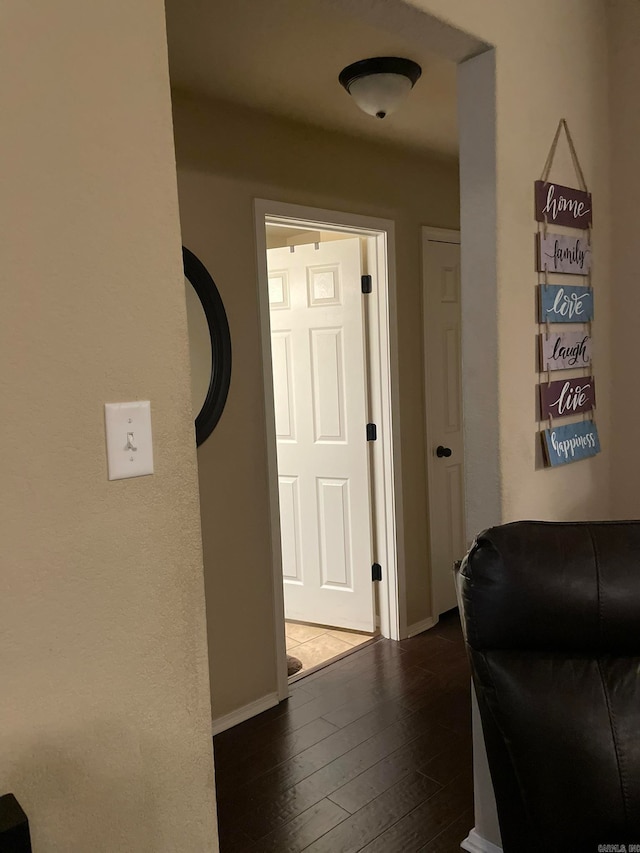 hallway featuring dark hardwood / wood-style flooring