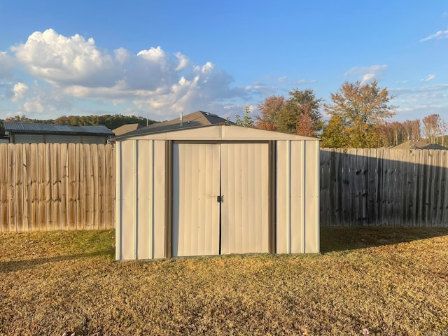 view of outdoor structure featuring a lawn