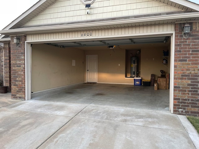 garage featuring a garage door opener and electric water heater