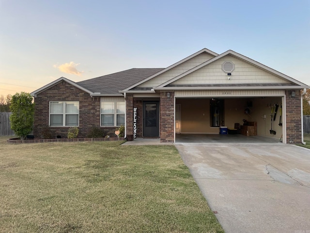 view of front of home featuring a garage and a lawn