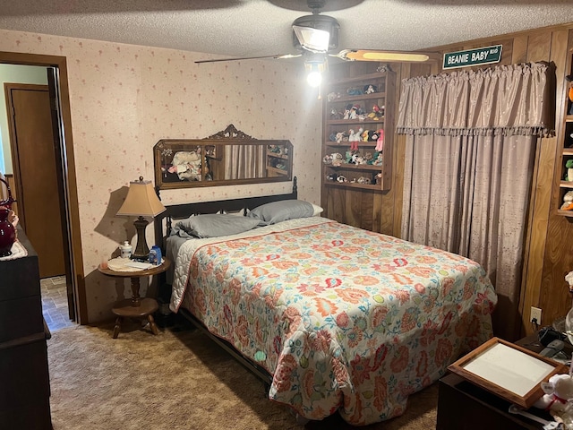 carpeted bedroom with a textured ceiling and ceiling fan