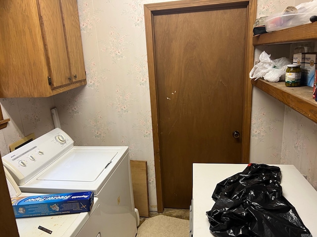 laundry area featuring cabinets and separate washer and dryer