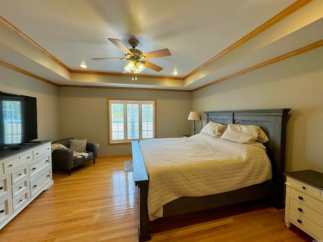 bedroom featuring ornamental molding, multiple windows, light hardwood / wood-style floors, and ceiling fan